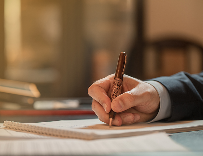 Director signing documents with a fashion pen. High quality photo