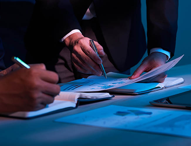 Close-up image of business partners working with financial documents